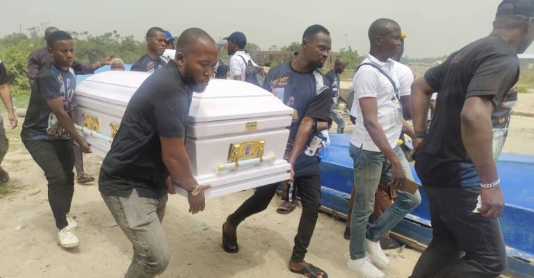 Sylvester Oromoni’s Casket being carried at the burial. Photo Credit: Matthew Ochei