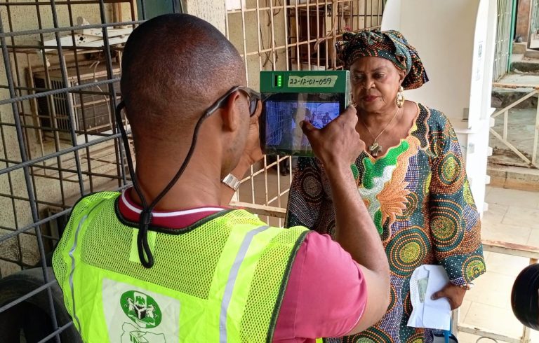 An INEC official attending to a voter in Lokoja