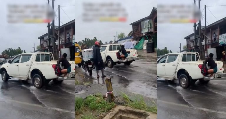 "When you are going to office and you don’t want to get wet" – Reaction as lady grabs onto a moving vehicle in an attempt to cross a flooded road (VIDEO)