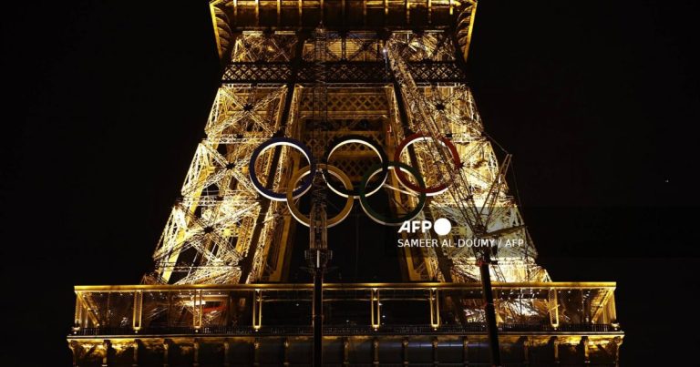 Olympic rings shine on Eiffel Tower