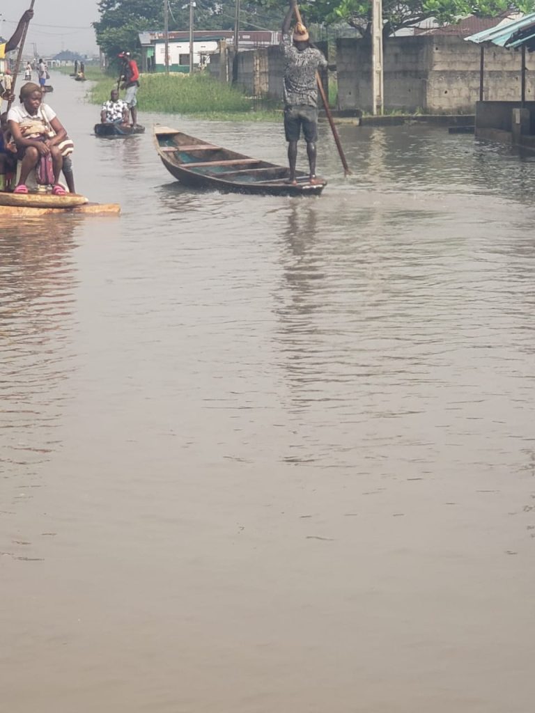 Flood submerges Lagos community, residents resort to canoe 1