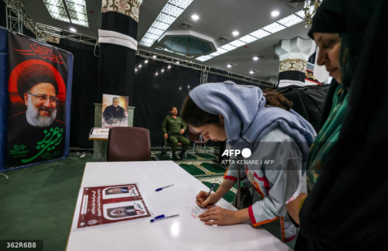 Iranian women prepare to cast their ballots at a polling station in Tehran on July 5, 2024.