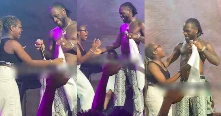 "Na man dey do man" – Online users react to Burna Boy hugging a female fan on stage at a recent concert (WATCH)